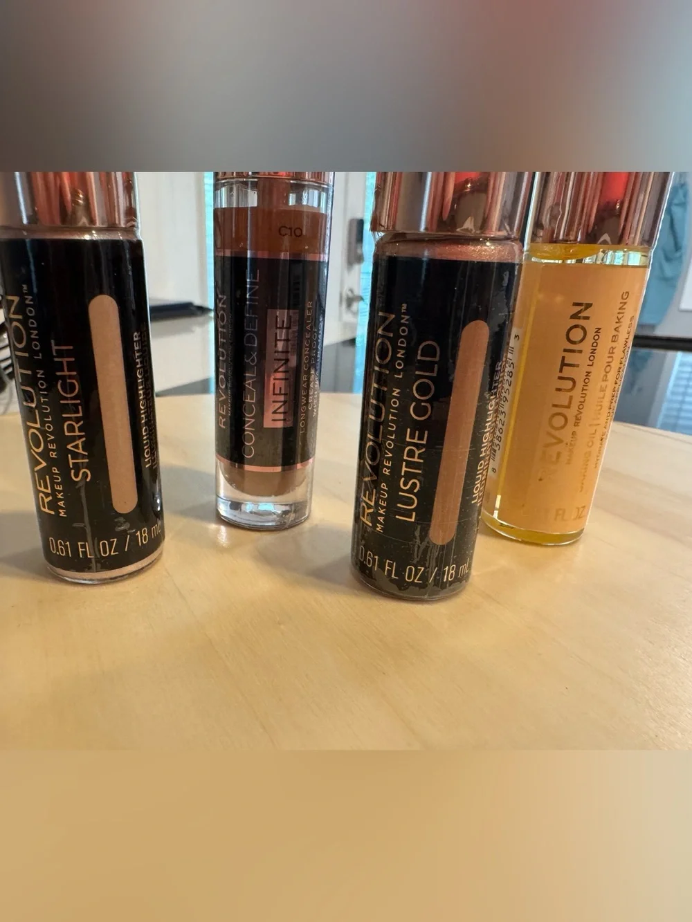Revolution Concealer, Liquid Highlighters, and Baking Oil. All 4 included. NWT